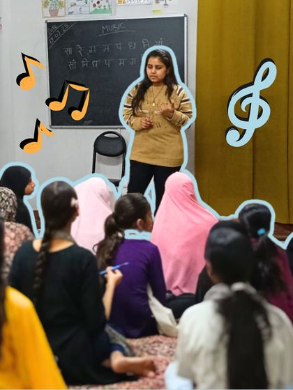 An instructor guides her students through vocal warm-ups. The blackboard behind them shows the musical notes, combining auditory and visual learning.