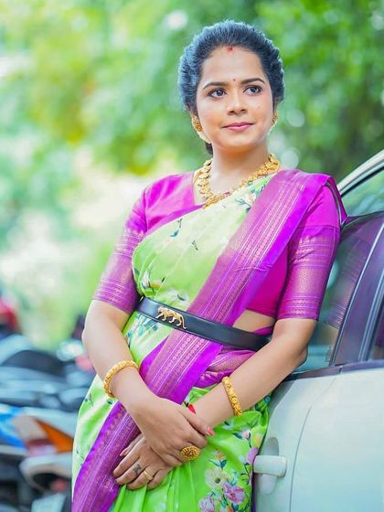 Our client Poojitha radiates beauty in this unique silk amalgamation of Kanchi and floral prints, styled with a modern belt.