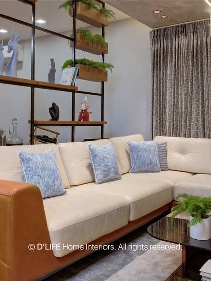 A view of the living room showing the comfortable sectional sofa and the open-plan layout that connects to the dining area, perfect for modern family life.