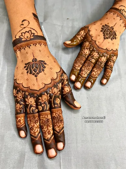 A beautiful back-of-hand design featuring lotus motifs. The pattern is light and open, perfect for someone who prefers a less dense mehndi look.