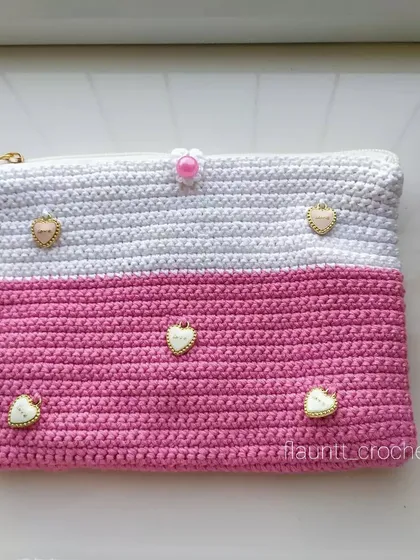 For the pink lover, a custom-made crochet clutch. This one is half white and half pink, and I added these adorable little heart charms to make it extra special.