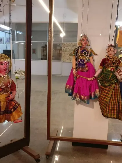 Puppets on display, framed to highlight their individual artistry. This allows viewers to appreciate the craftsmanship of each character up close, outside of a full performance.
