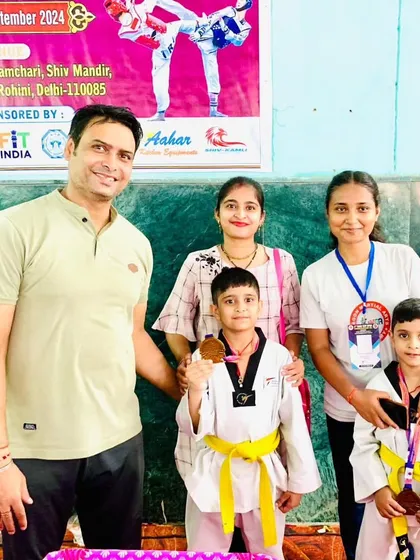A family celebrating their two sons' victories at the Vijay Cup. We love seeing parents support their children's passion.