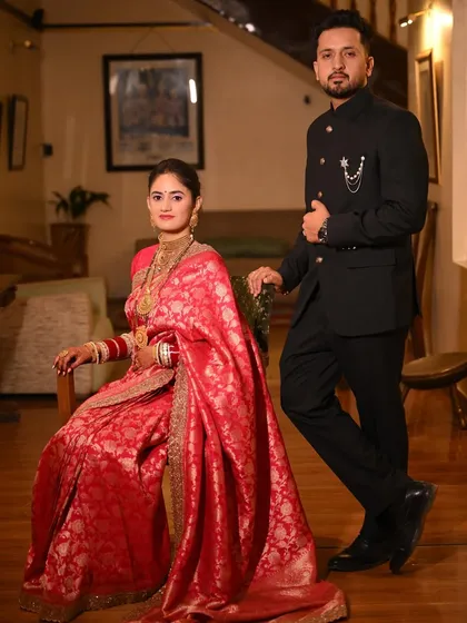A regal and posed portrait of the couple during their reception. The classic composition and their elegant attire give this a timeless, royal feel.