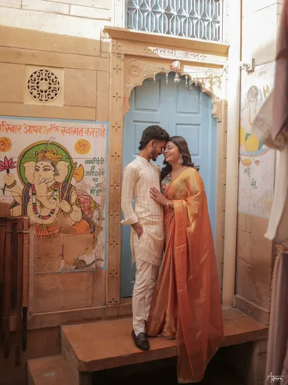 A quiet, intimate moment for Prince and Khushi in the rustic lanes of Jaisalmer. The traditional artwork on the wall adds a layer of cultural richness to this beautiful save-the-date portrait.