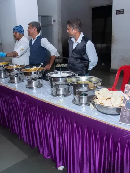 My staff serving at a corporate lunch. You can see my branding on the table, which adds a professional touch.