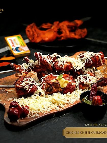 This is what cheesy obsession looks like. Our Chicken Cheese Overload Tandoori features skewers of tender chicken tikka buried under a mountain of grated cheese, a perfect fusion of smoke and melt.