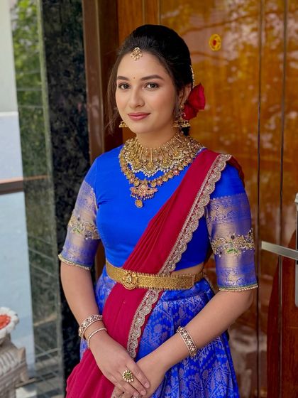 A portrait of the client looking directly at the camera, her gentle smile reflecting the joy of the occasion.