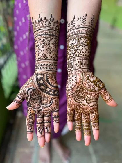 A lovely mid-arm design with a mix of floral and geometric elements, perfect for any celebration.