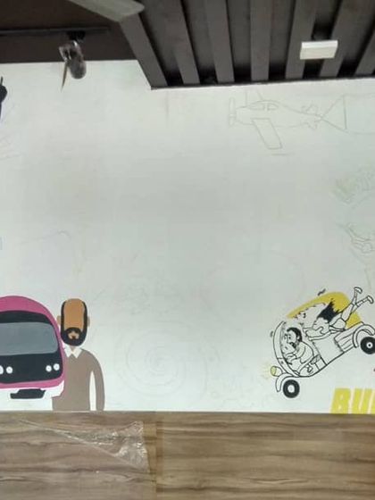 The Dosa Plaza mural in its early stages. We sketch out the entire composition on the wall before we start painting to make sure everything fits.