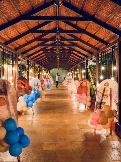 A stunning walkway lined with photos of the birthday twins, creating a personalized journey for guests.