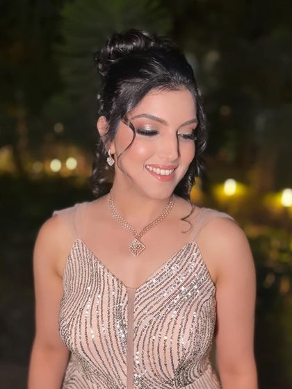 The complete look is a perfect blend of modern princess vibes and classic elegance. The makeup is soft yet defined, letting her natural beauty take center stage.