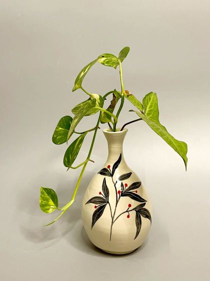 Explore my exquisite hand-painted vases, each a unique masterpiece crafted with love and skill. By supporting my small business, you are investing in passion, creativity, and community.