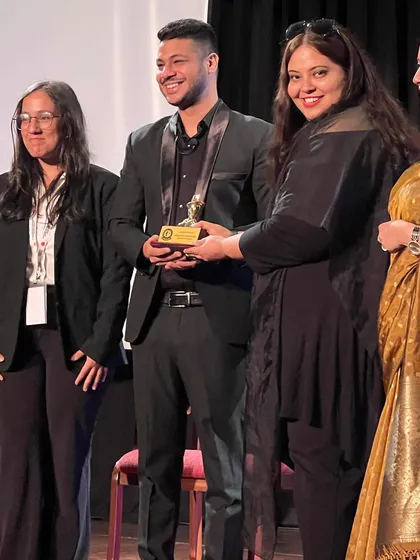 A close-up of the moment I received my speaker's trophy at TEDx SBSC. I'm grateful for the opportunity to have been a part of such a well-organized and inspiring event.