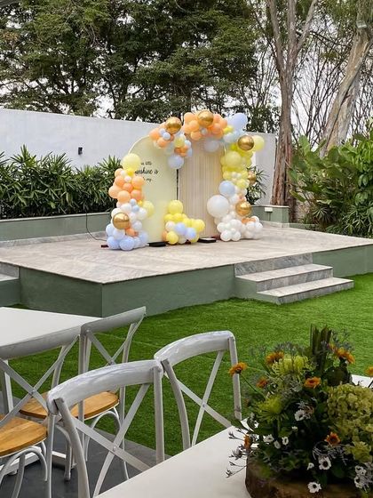A simple yet elegant setup for a Seemantham or baby shower at The Backyard. The focus is on the clean, open space and the beautiful natural surroundings.