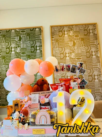 The full view of the 'Twelve and Thriving' hamper, personalized with the birthday girl's name, Tanishka, and a light-up number '12'.