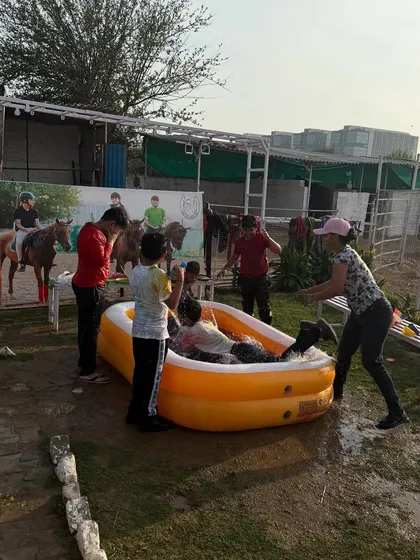 Guests enjoying a water fight in and around the pool during our lively Holi festivities.