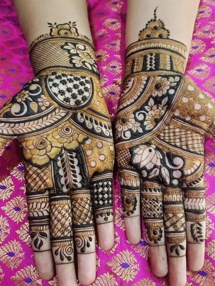 A beautiful design for the palms only. This style is perfect for festivals or smaller family functions, offering intricate art without the commitment of a full-arm design.