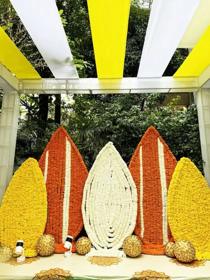 We honor tradition by weaving it into stunning visual stories. This vibrant backdrop, made entirely of fresh marigolds and jasmine, was the heart of a Myra ceremony, creating a sacred space that felt both grand and deeply personal.
