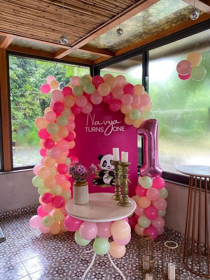 This shot includes the large number '1' foil balloon, a must-have for any first birthday party.