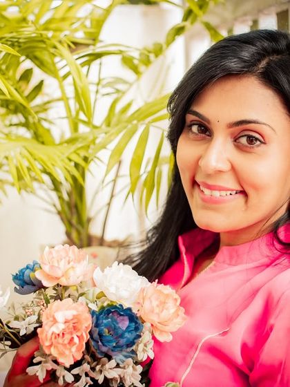 A bright and happy portrait holding a bouquet of flowers. This shot is full of warmth and positive energy.