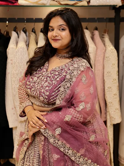 Another angle of this beautiful pink lehenga, showing its full silhouette against the backdrop of my extensive in-store collection.