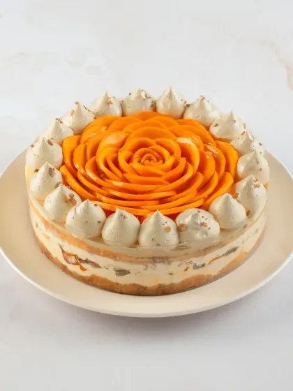 Our Mango Tres Leches cake is a true delight. It's a light sponge soaked in three kinds of milk, layered with fresh mangoes and topped with a beautiful mango rose.