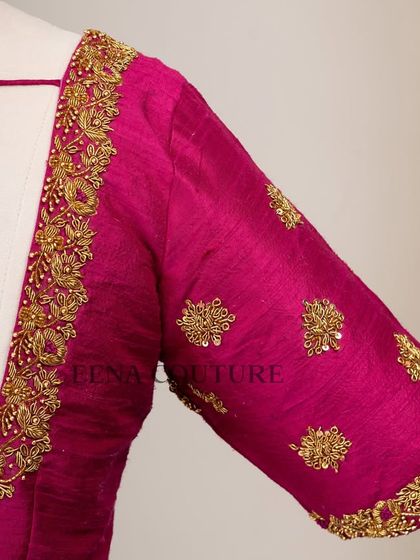 The classic Katori blouse is all about the perfect fit and timeless charm. This version in magenta raw silk is adorned with simple but elegant gold butti embroidery, making it a versatile choice for any traditional event.