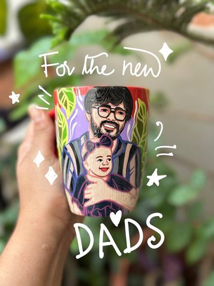 For the new dads: a mug capturing the special bond between a father and his baby.