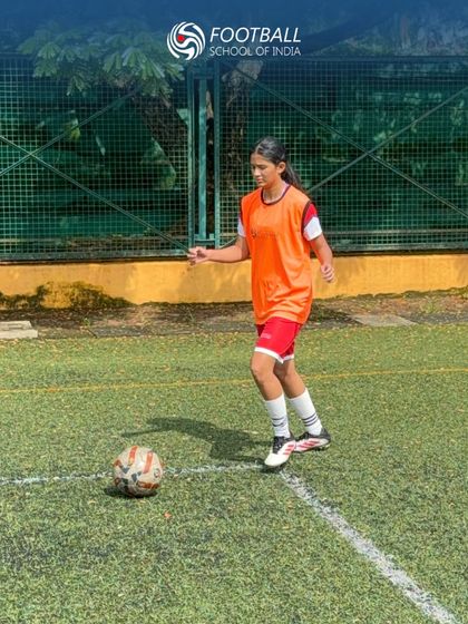 A young girl dribbles with focus during our U15 trials, showcasing her technical ability.