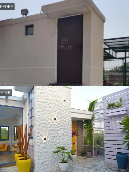 This small rooftop storage unit was transformed into a stylish structure with textured walls and modern lighting, integrating it beautifully into the overall garden design.