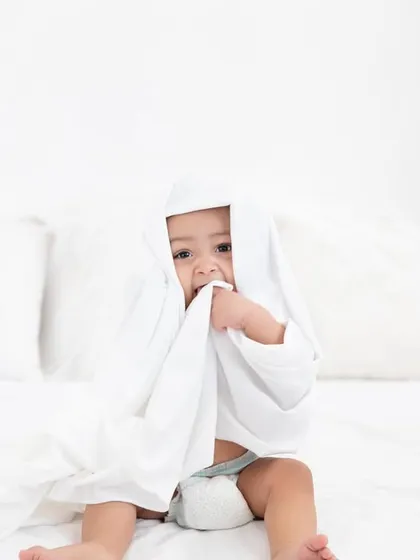 Hiding under the covers. This shy but sweet moment is another example of the fun and games we play during a session.