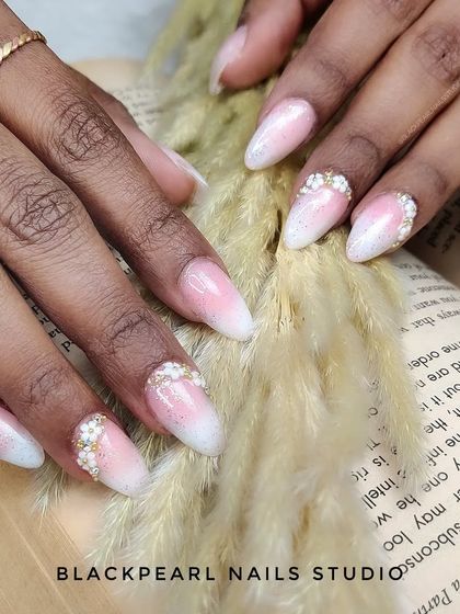 Here is a classic baby boomer nail set, enhanced with delicate floral designs made from tiny beads on the accent fingers. This design is a favorite among brides for its romantic and sophisticated feel, offering a timeless look with a touch of texture.