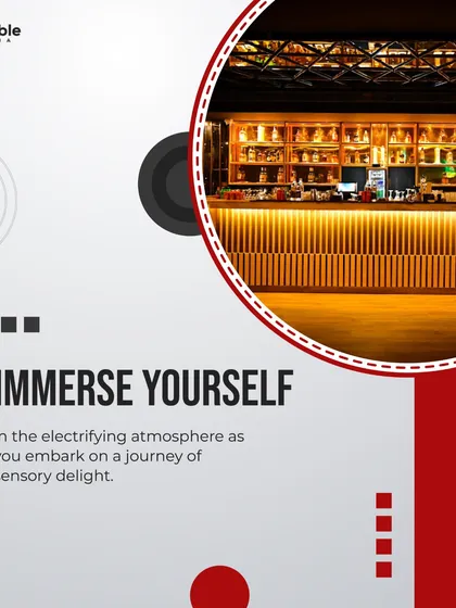 The bar at The Knot Club, illuminated to create an inviting and electrifying atmosphere. The warm, layered lighting on the back bar makes it a focal point of the venue.