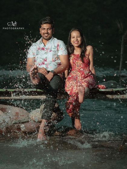 Capturing a spontaneous splash in the river, this photo shows the fun and natural moments we aim to capture during our pre-wedding sessions.
