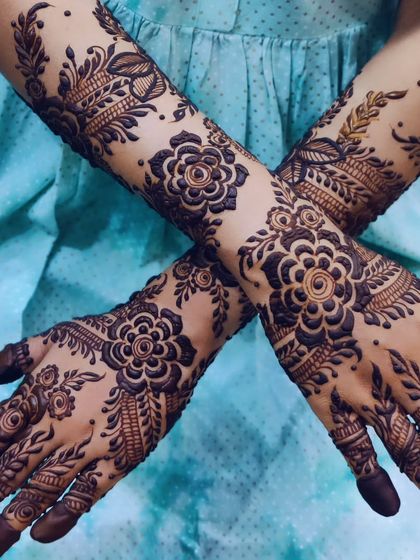 Bold floral bands that wrap around the arms. This design is perfect for someone who wants a statement piece that is both modern and traditional.