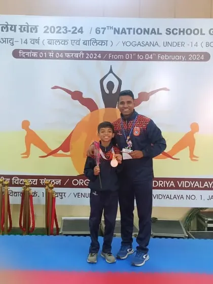 This is what we train for. We are incredibly proud of our student, Vidhish Raut, standing with coach Fayaz Jamadar after winning a medal at the 67th National School Games for Yogasana. This moment represents the dedication and hard work we instill in every athlete.