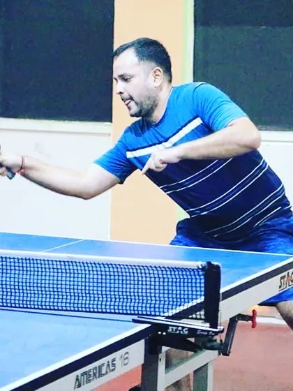 We also have a strong group of adult and corporate players. This action shot shows one of our adult players, Shubham, competing in a corporate table tennis tournament.