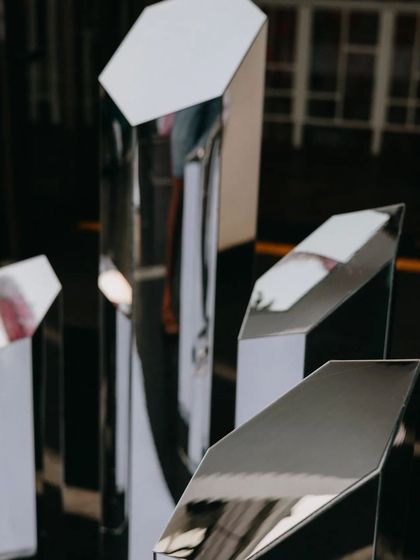 Geometric mirror pillars that guests could interact with, reflecting the crazy lights and energy of the after-party.