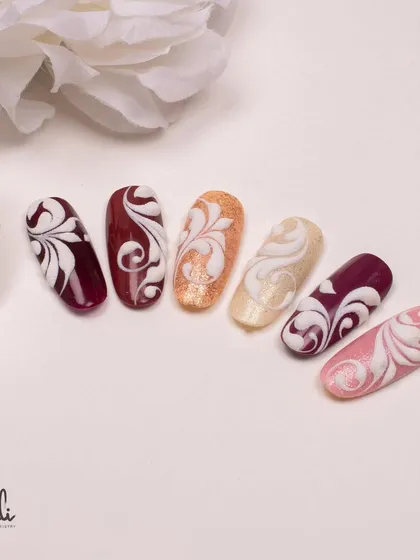 Here, I've combined embossed swirls with a textured sand effect. This demonstrates how you can layer different techniques for a unique finish.
