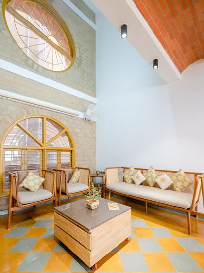 The living room 옆, showing the play of light and the simple elegance of the furniture.