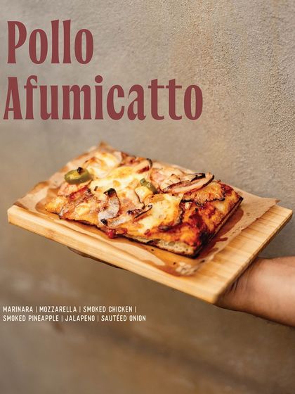 The Pollo Afumicatto slice, a smoky and sweet combination of smoked chicken, smoked pineapple, and jalapeños.