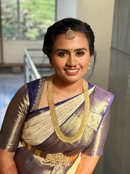 A beautiful portrait of this bride, her smile radiating happiness and her makeup looking fresh and natural.