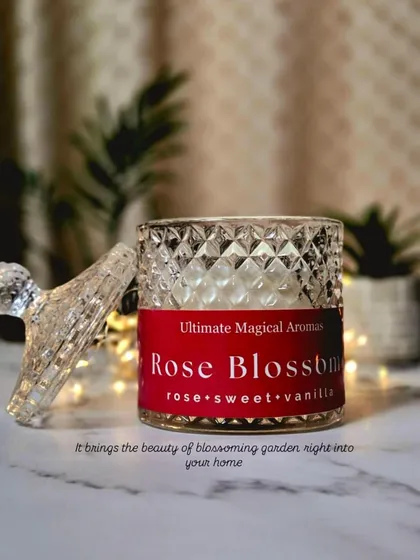 This is the 'Rose Blossom' Crystal Jar Candle. With its notes of rose, sweet, and vanilla, it brings the beauty of a blossoming garden right into your home.