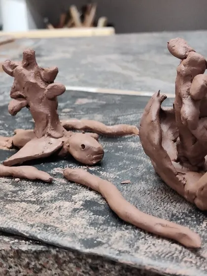 Clay sculptures of an axolotl and another creature. I often learn new things about the animal kingdom from my knowledgeable young students.