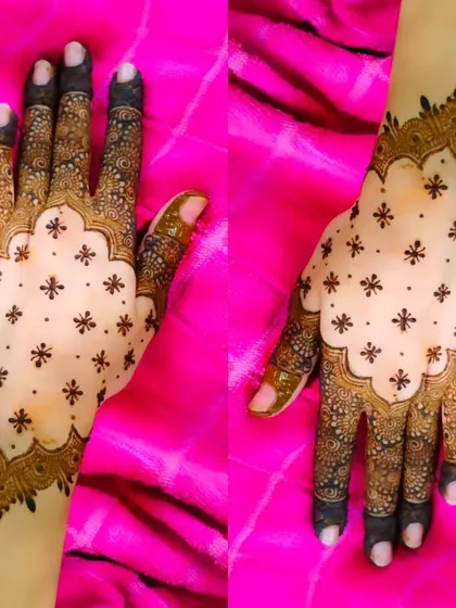 This is an example of a modern Pakistani-style design. The combination of a bold border, delicate 'buti' (dots), and intricate finger details creates a look that is both traditional and chic.