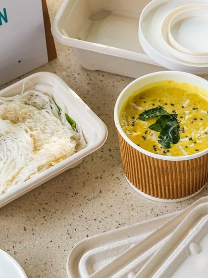 Our Nadan Coconut Curry, a taste of Kerala, delivered with delicate idiyappam. The light, string hoppers are the perfect vehicle for soaking up the fragrant and creamy coconut-based curry.