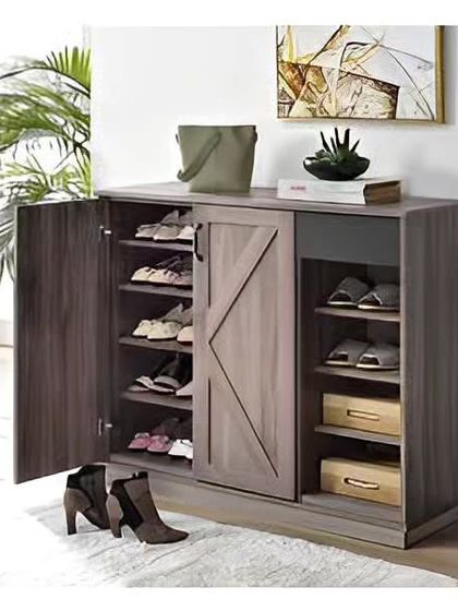 We built this rustic-style shoe cabinet to provide ample storage for the whole family. The design features a combination of open shelves and closed cabinets with a charming barn-style sliding door.