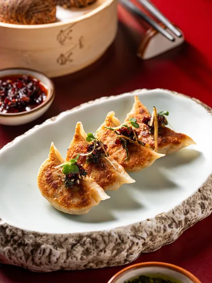 Our Corn & Cheese Gyoza are flash-fried to a perfect golden crisp and served with artisanal kimchi and fragrant chilli oil for a refined, flavour-packed appetizer.