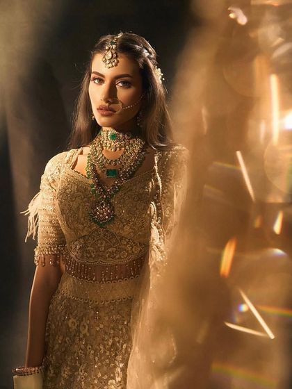 Another angle of this dreamy bridal portrait, showcasing the soft, diffused lighting and the radiant makeup that gives the bride an almost angelic glow.